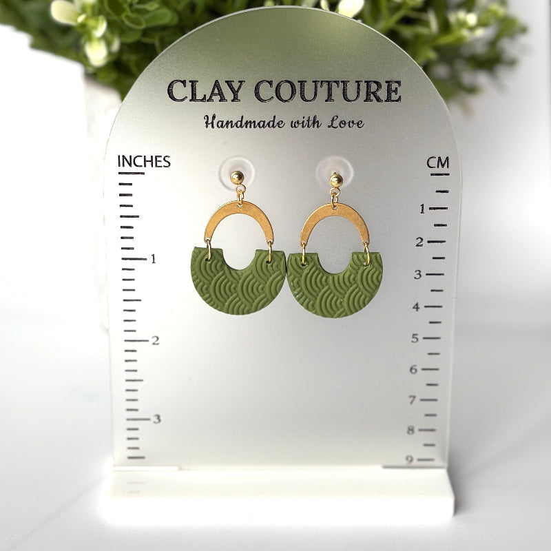 Polymer clay earrings in olive grove color with brass connectors and 18K gold plated studs  on a 'Clay Couture' size stand