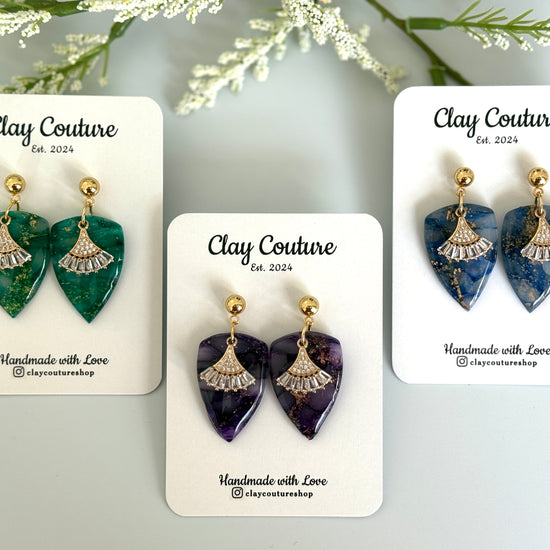 Dagger shaped polymer clay earrings with resin finish and gold studs in three different colors 