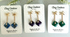 Three Pairs of Earrings on a Clay Couture branded cards
